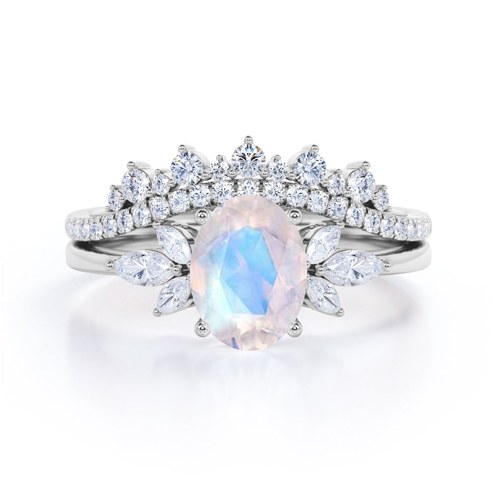 Garland Inspired 1.65 carat Oval shaped Blue Moonstone and diamond contoured seven stone Bridal set in Black gold
