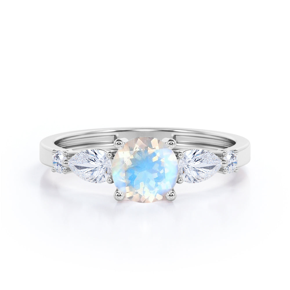 Modern 1.15 carat Round cut Blue Moonstone and diamond marquise 5 stone engagement ring in Rose gold