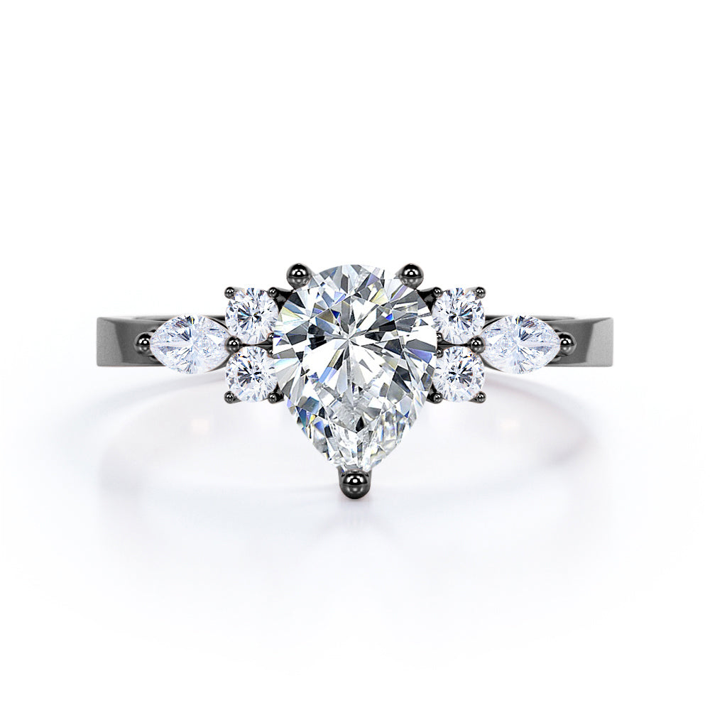 Antique 7 stone 1.1 carat Pear Shaped Moissanite and diamond 3 prong engagement ring in Rose gold