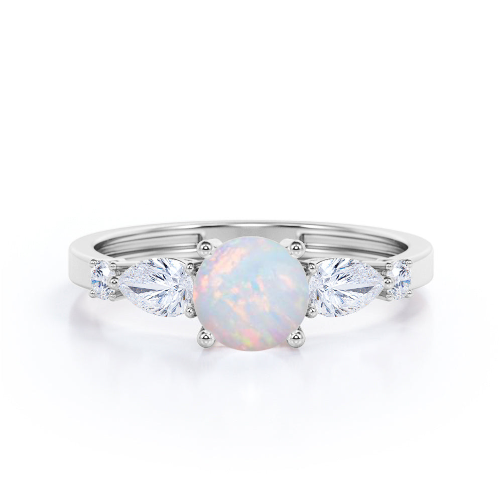Eccentric 1.25 carat Round cut Ethiopian Opal and marquise and dot diamond engagement ring in Rose gold