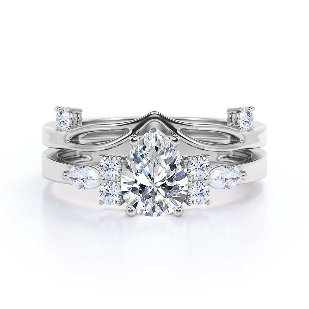 Split shank Chevron 1.2 carat tear drop shaped Moissanite and diamond art deco style engagement ring in Black gold