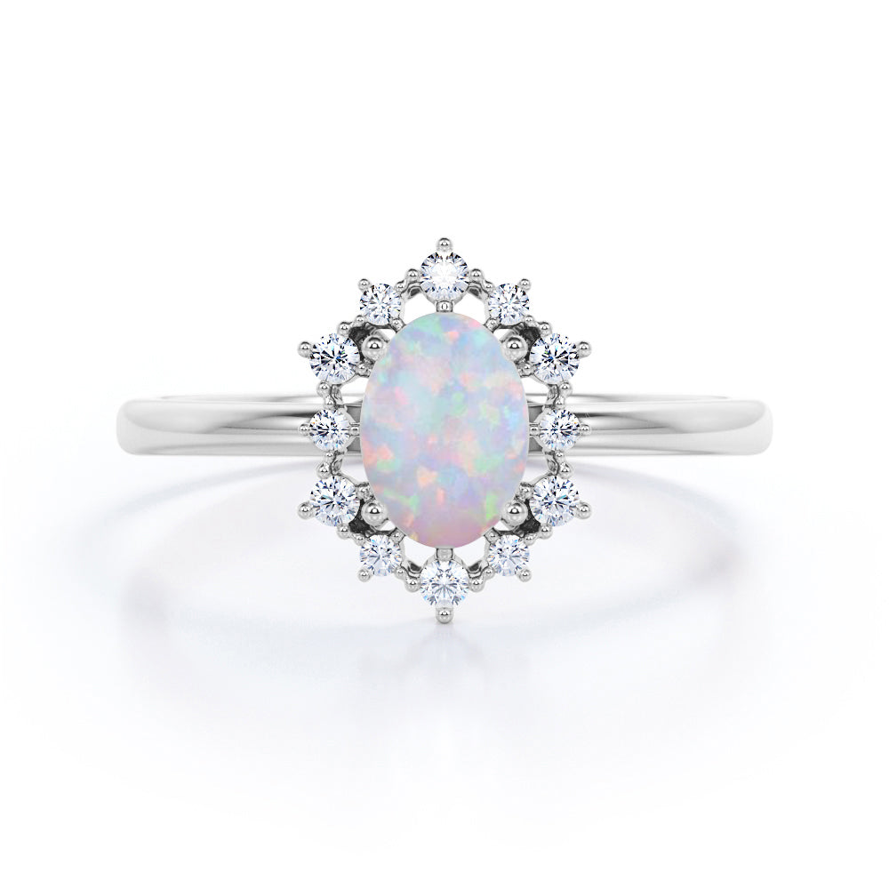 Intricate cluster 1.15 carat Oval cut Ethiopian Opal and diamond art deco engagement ring in Black gold