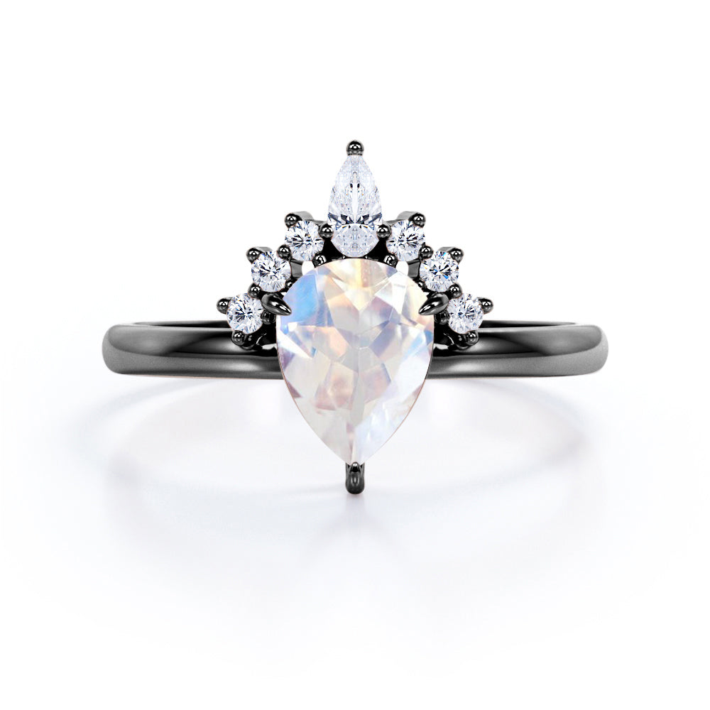 Crown Tiara inspired 1.2 carat Pear cut Rainbow Moonstone and diamond prong style engagement ring in Rose gold