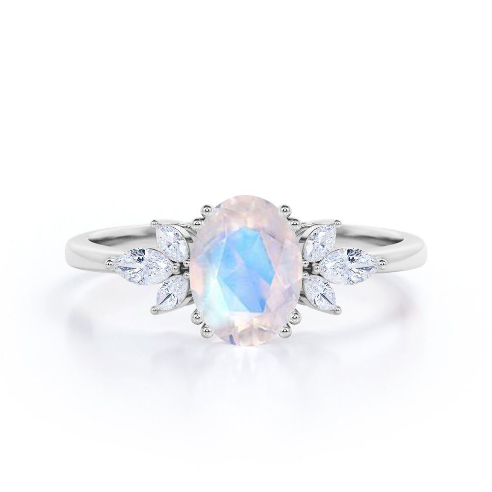 Floral inspired 1.25 carat Oval cut Rainbow Moonstone and marquise diamond double prong engagement ring in Black gold
