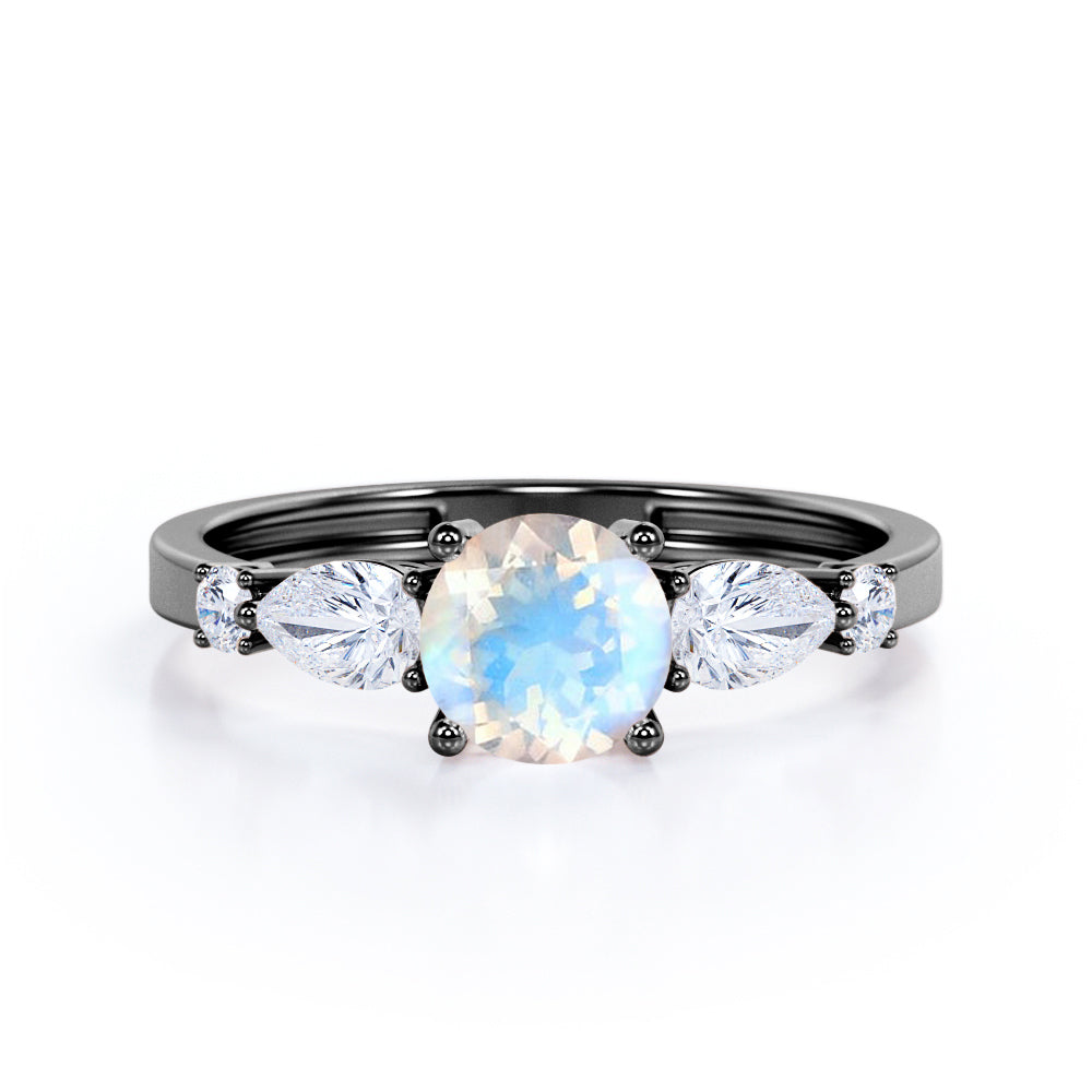 Modern 1.15 carat Round cut Blue Moonstone and diamond marquise 5 stone engagement ring in Rose gold