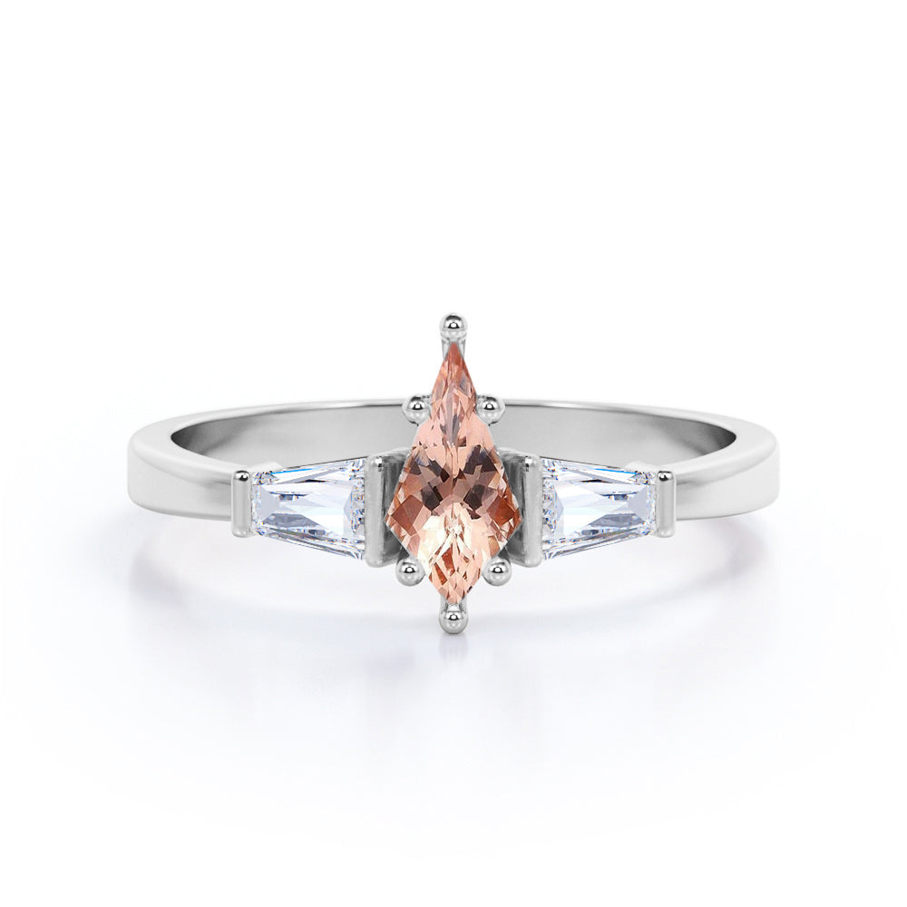 Baguette style 1.1 carat Kite shaped Morganite and diamond three stone anniversary ring in Black gold