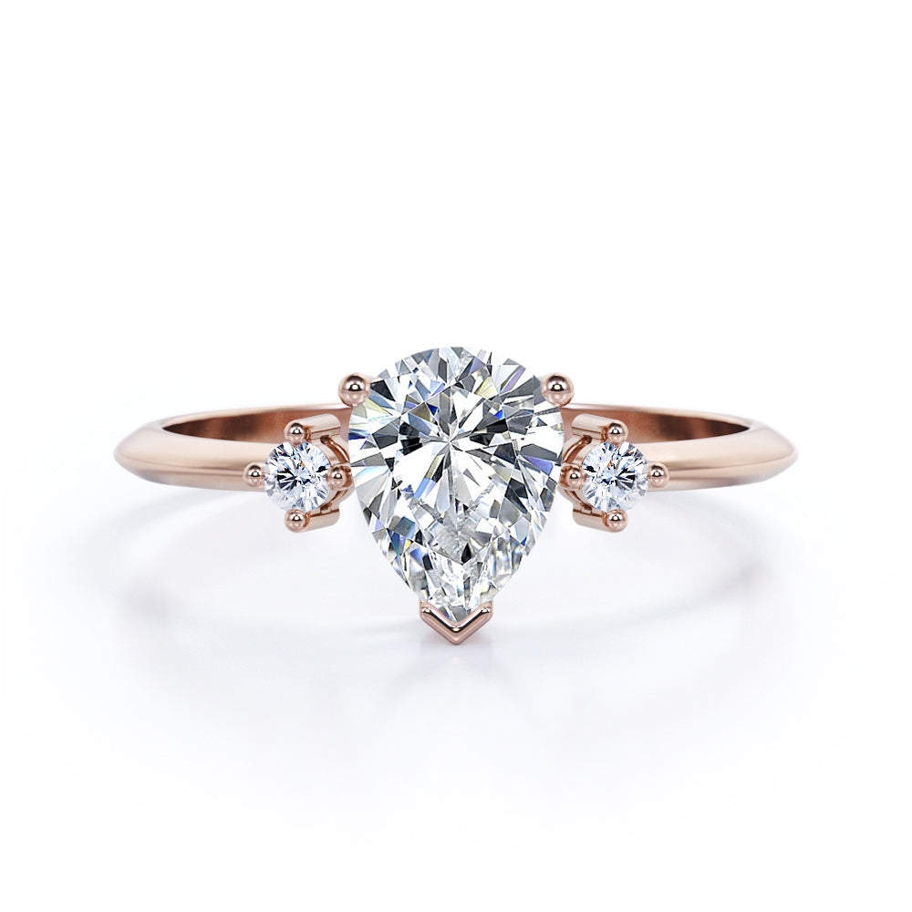 Classic Trinity 1 carat Pear shaped Moissanite and diamond-prong setting-pinched shank engagement ring in White gold