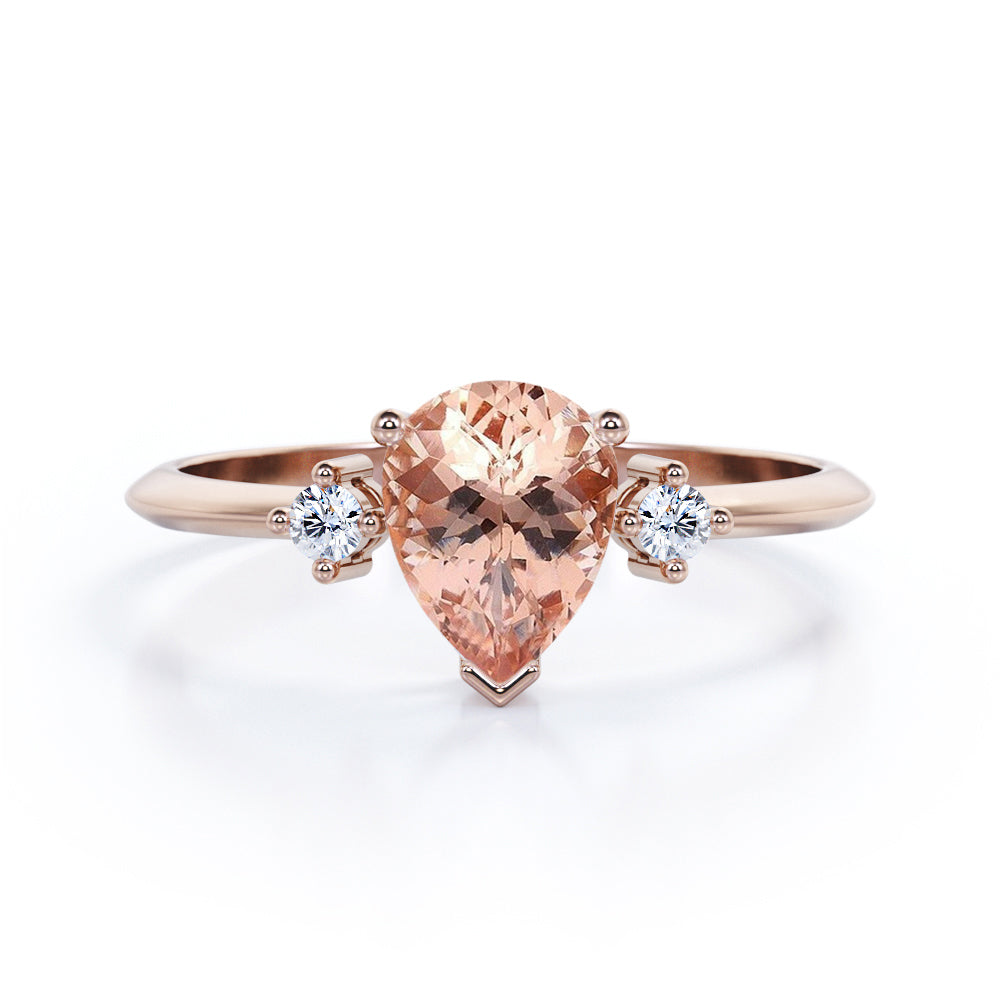 Three prong setting 1.1 carat Pear shaped Morganite and diamond trilogy anniversary ring for women in Black gold