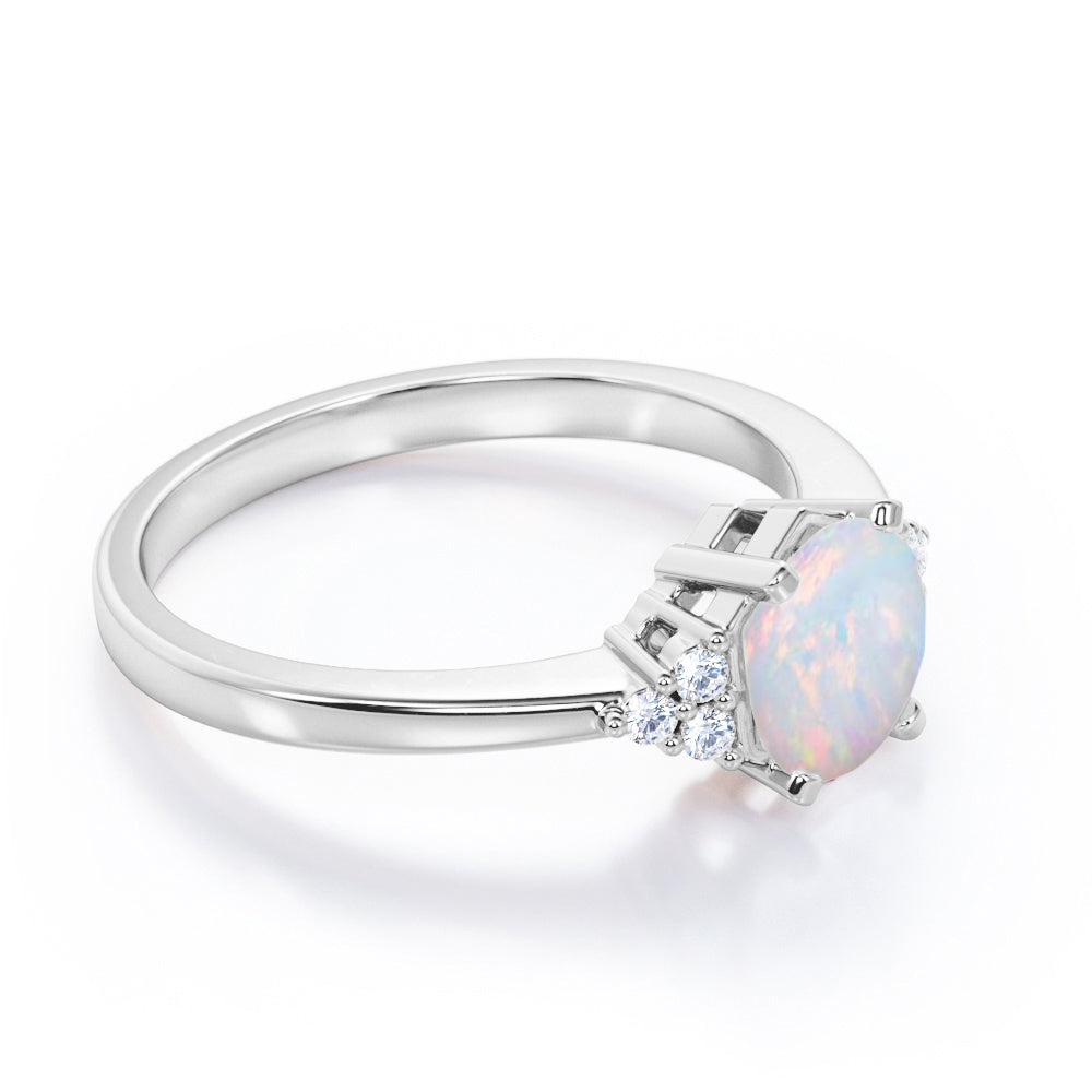 Unique Tapered style 1 carat Round cut Opal and diamond 7 stone engagement ring in Yellow gold