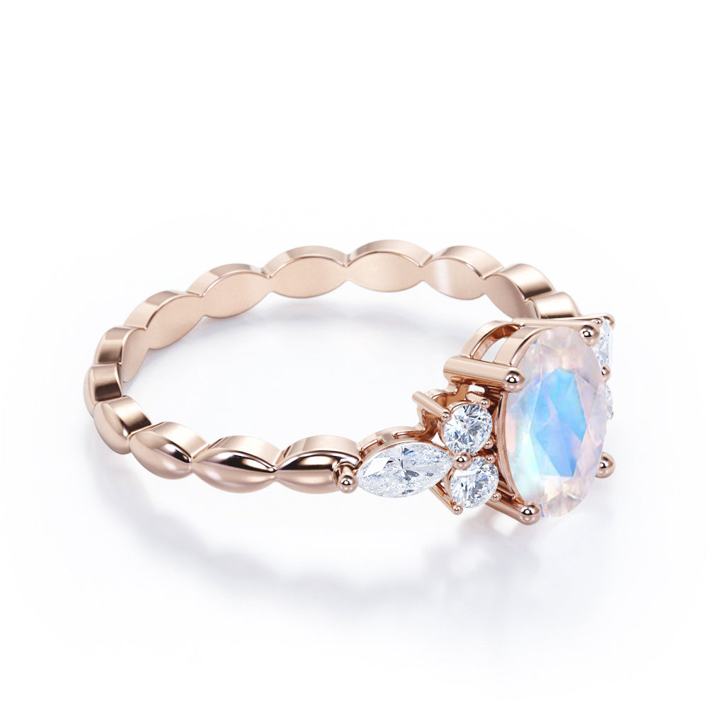 Scalloped Rope Design 1.15 carat Oval cut Moonstone and diamond 7 stone engagement ring in White gold