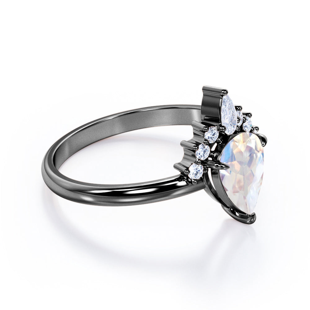 Crown Tiara inspired 1.2 carat Pear cut Rainbow Moonstone and diamond prong style engagement ring in Rose gold