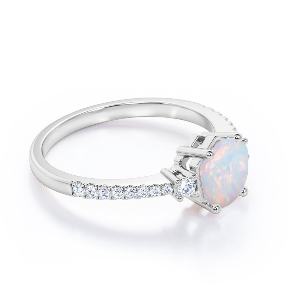 Contemporary 3 stone 1.2 carat Round cut Ethiopian Opal and diamond basket setting low basket setting engagement ring in White gold
