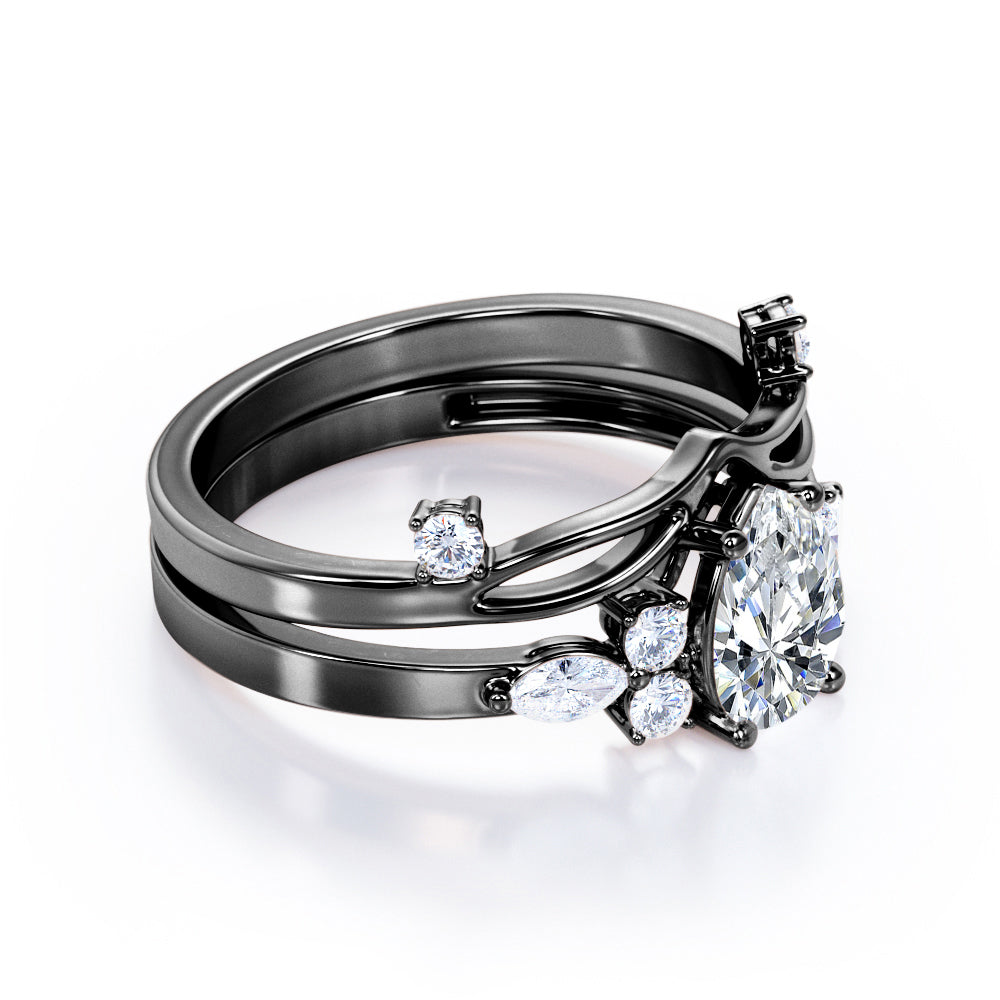 Split shank Chevron 1.2 carat tear drop shaped Moissanite and diamond art deco style engagement ring in Black gold