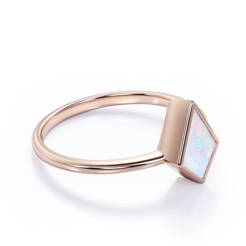Solitaire Bezel 1 carat Kite shaped Ethiopian Welo Opal tapered shank engagement ring in Rose gold