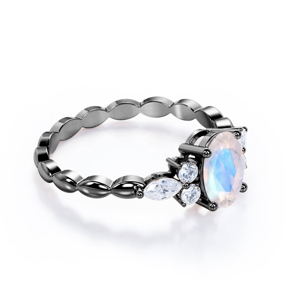 Scalloped Rope Design 1.15 carat Oval cut Moonstone and diamond 7 stone engagement ring in White gold