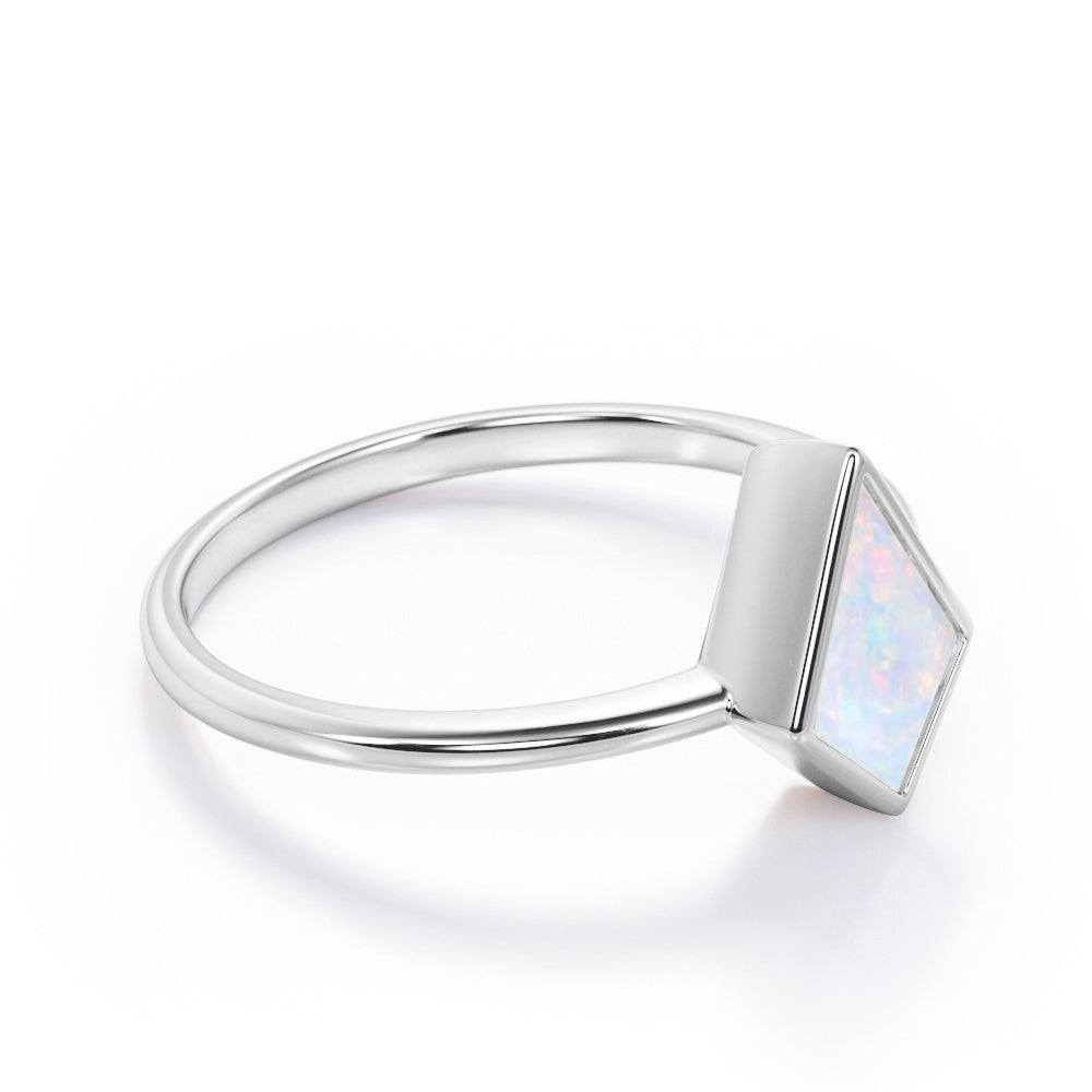 Solitaire Bezel 1 carat Kite shaped Ethiopian Welo Opal tapered shank engagement ring in Rose gold