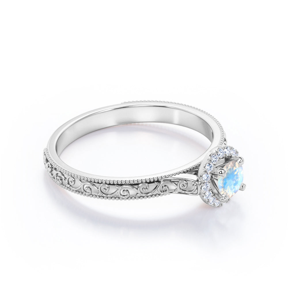 Ornamental Filigree 1.2 carat Round cut Moonstone and diamond halo engagement ring for women in Rose gold