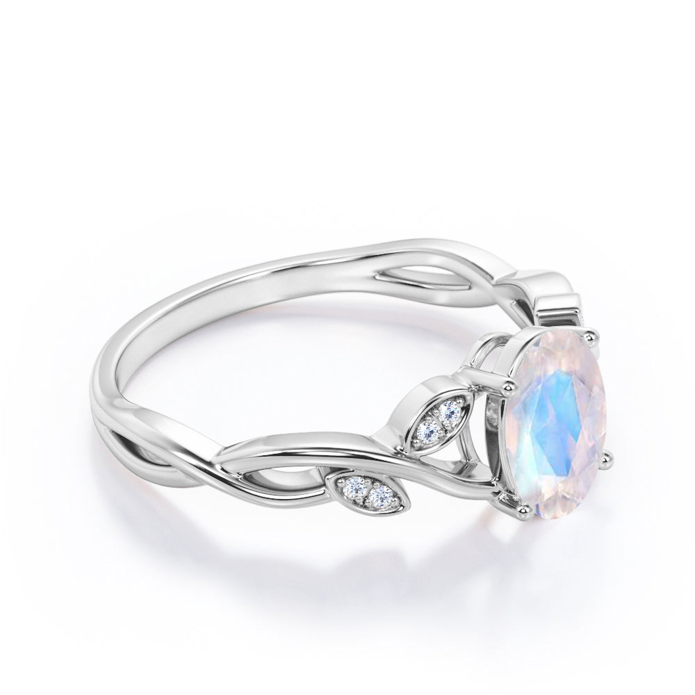 Twisted Vine 1.15 carat Oval cut Rainbow Moonstone and diamond forest inspired engagement ring in Rose gold
