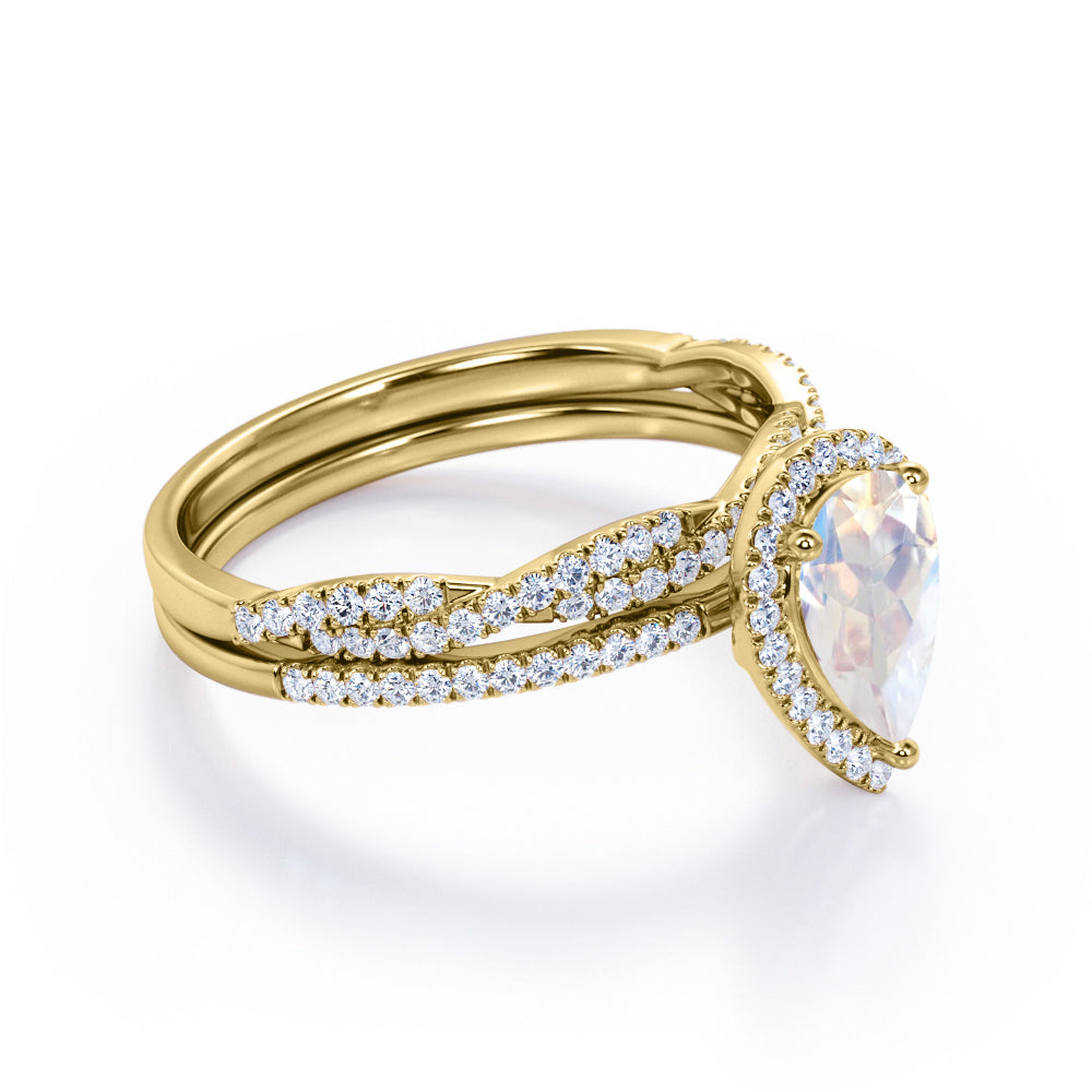 Exquisite 1.75 carat Pear cut Rainbow Moonstone Engagement ring with matching half eternity wedding ring band in gold