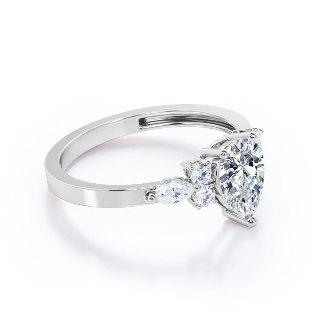 Antique 7 stone 1.1 carat Pear Shaped Moissanite and diamond 3 prong engagement ring in Rose gold