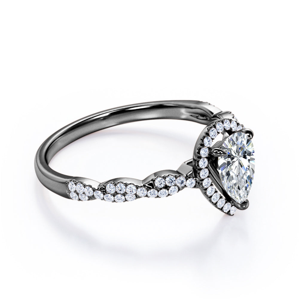 Twisted rope style 1.5 carat Pear cut Moissanite and diamond infinity halo engagement ring in Rose gold