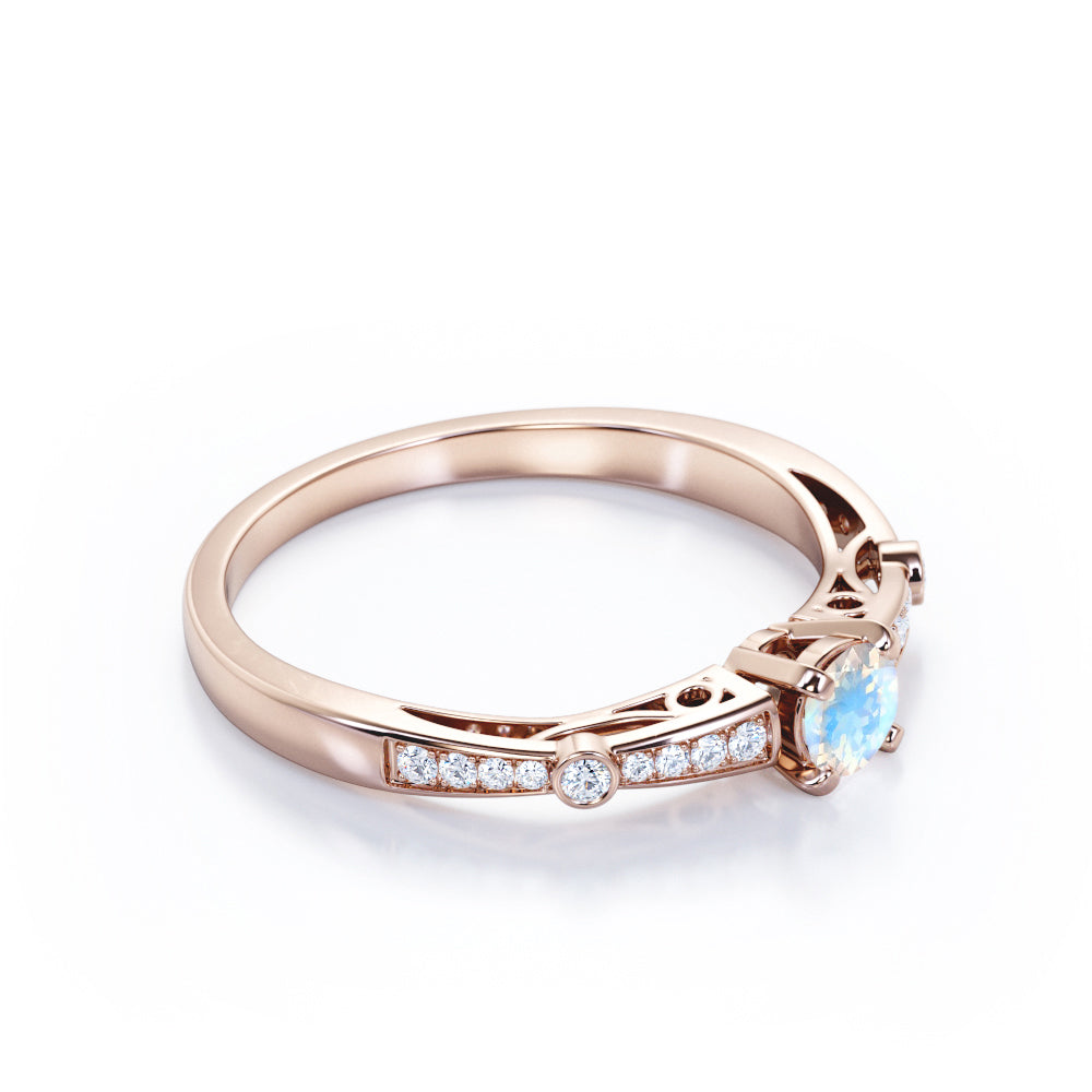 Basket set 1.25 carat Round cut Blue Moonstone and Diamond tapered shank engagement ring in Yellow gold