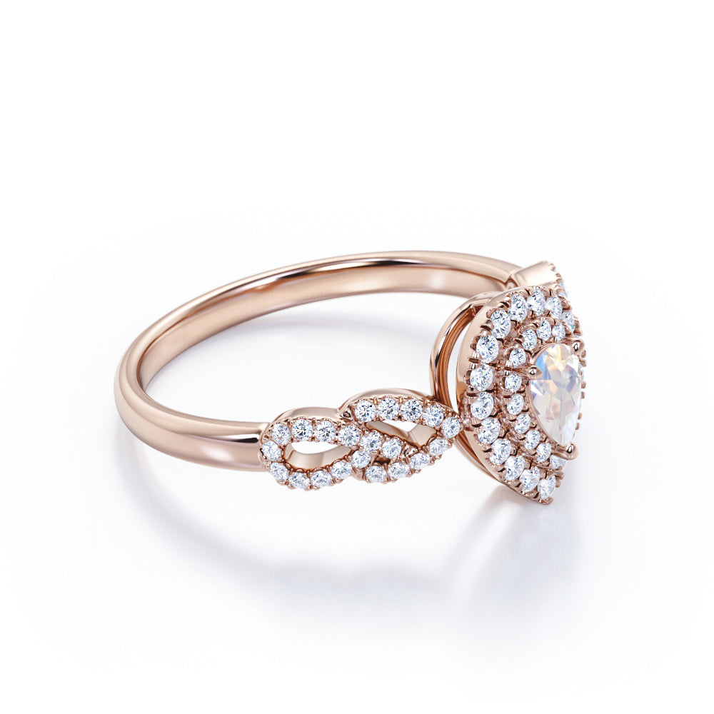 Intertwined 1.7 carat Pear shaped Blue Moonstone and diamond twisted infinity halo engagement ring in White gold