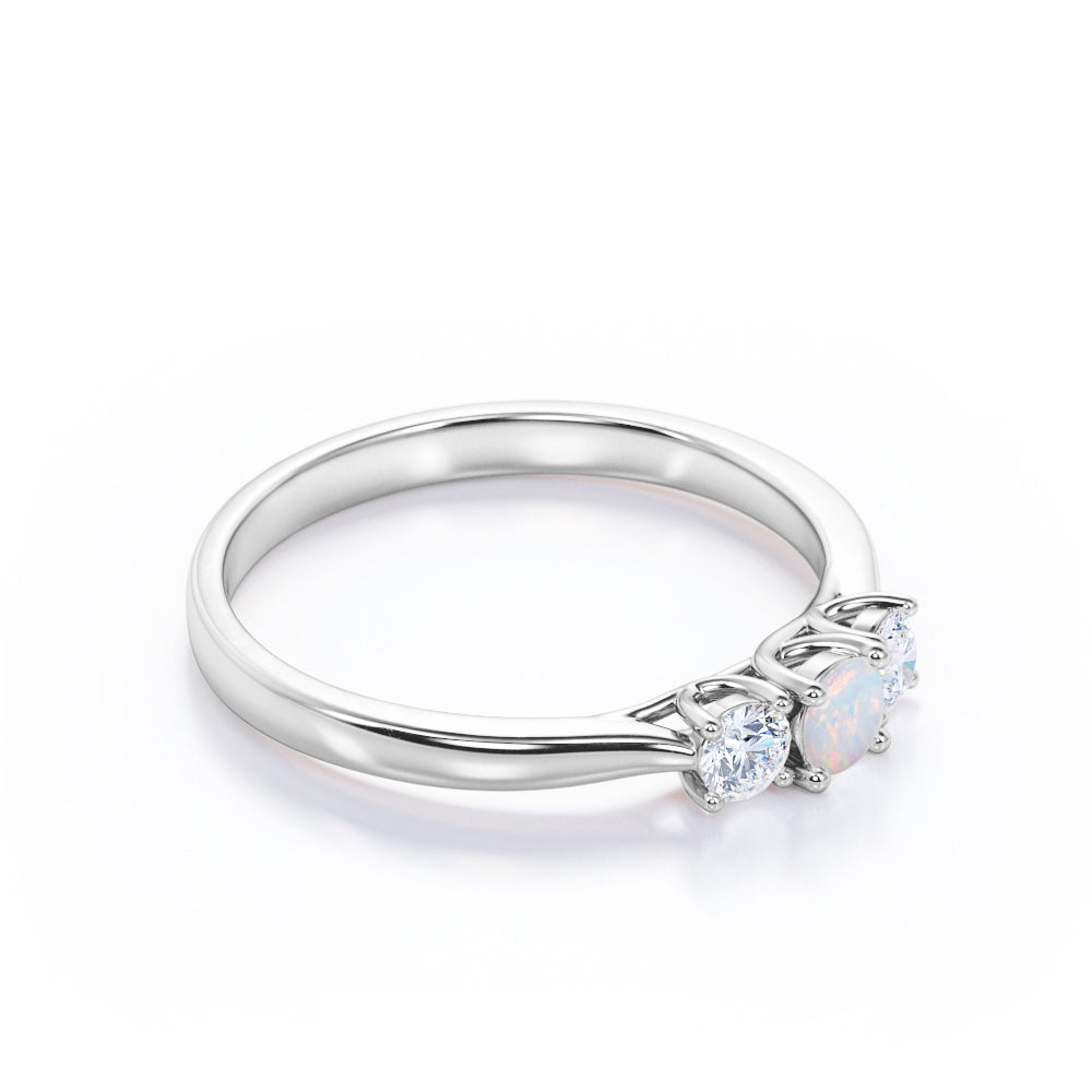 Tapered Shank 0.7 carat Round cut Ethiopian Opal and diamond triple stone engagement ring in Rose gold