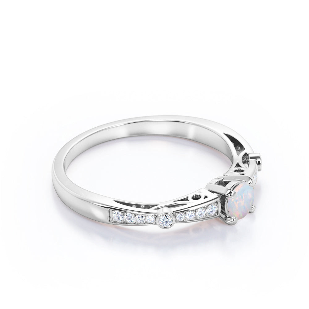 Artistic 0.66 carat Round cut Natural Ethiopian Opal and diamond art deco style engagement ring in Yellow gold