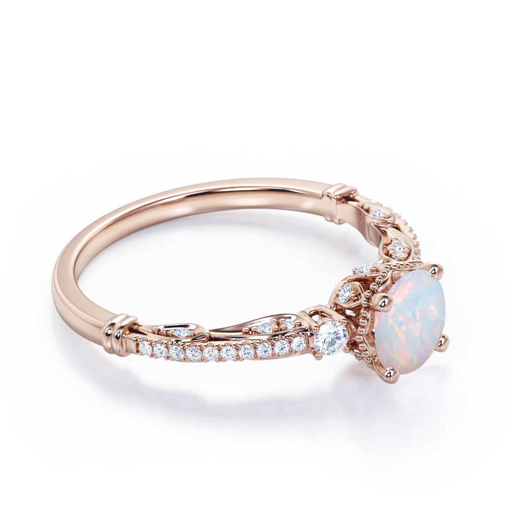 Artistic 3 stone 1.30 carat Round cut Ethiopian Opal and diamond antique art deco engagement ring in Black gold