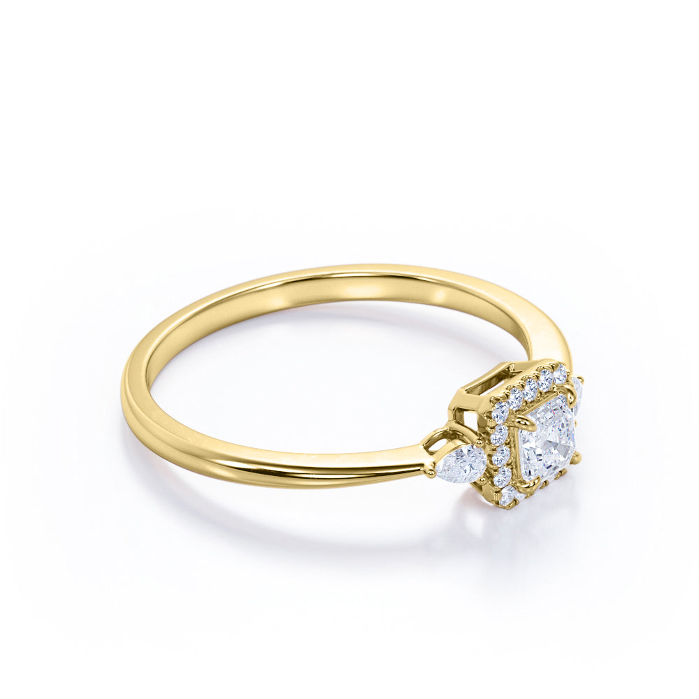 Tapered triple stone 0.7 carat Round cut Moissanite and diamond halo engagement ring in White gold