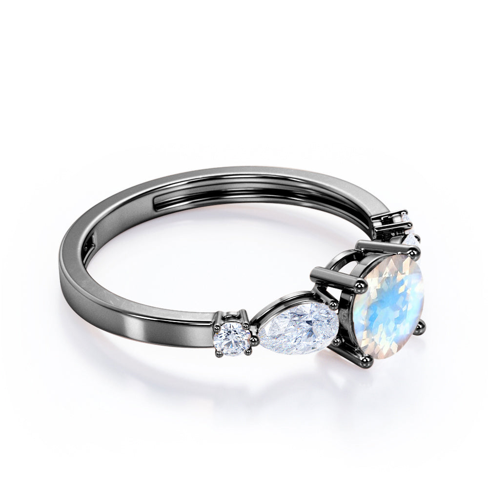 Modern 1.15 carat Round cut Blue Moonstone and diamond marquise 5 stone engagement ring in Rose gold