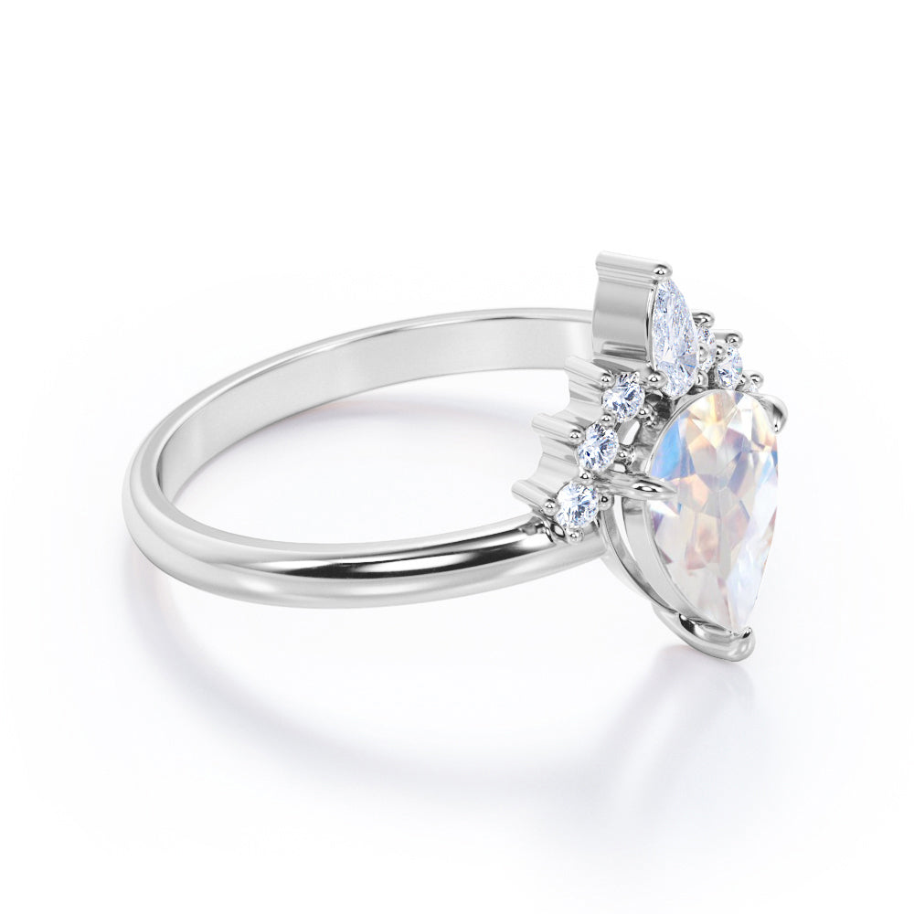 Crown Tiara inspired 1.2 carat Pear cut Rainbow Moonstone and diamond prong style engagement ring in Rose gold