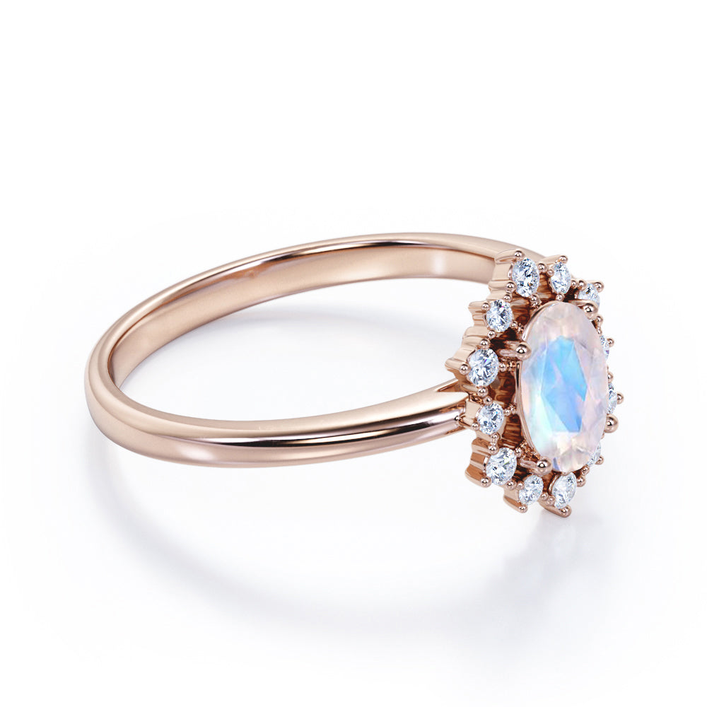 Snowflake inspired 1.25 carat Oval cut Moonstone and diamond unique halo engagement ring in Black gold