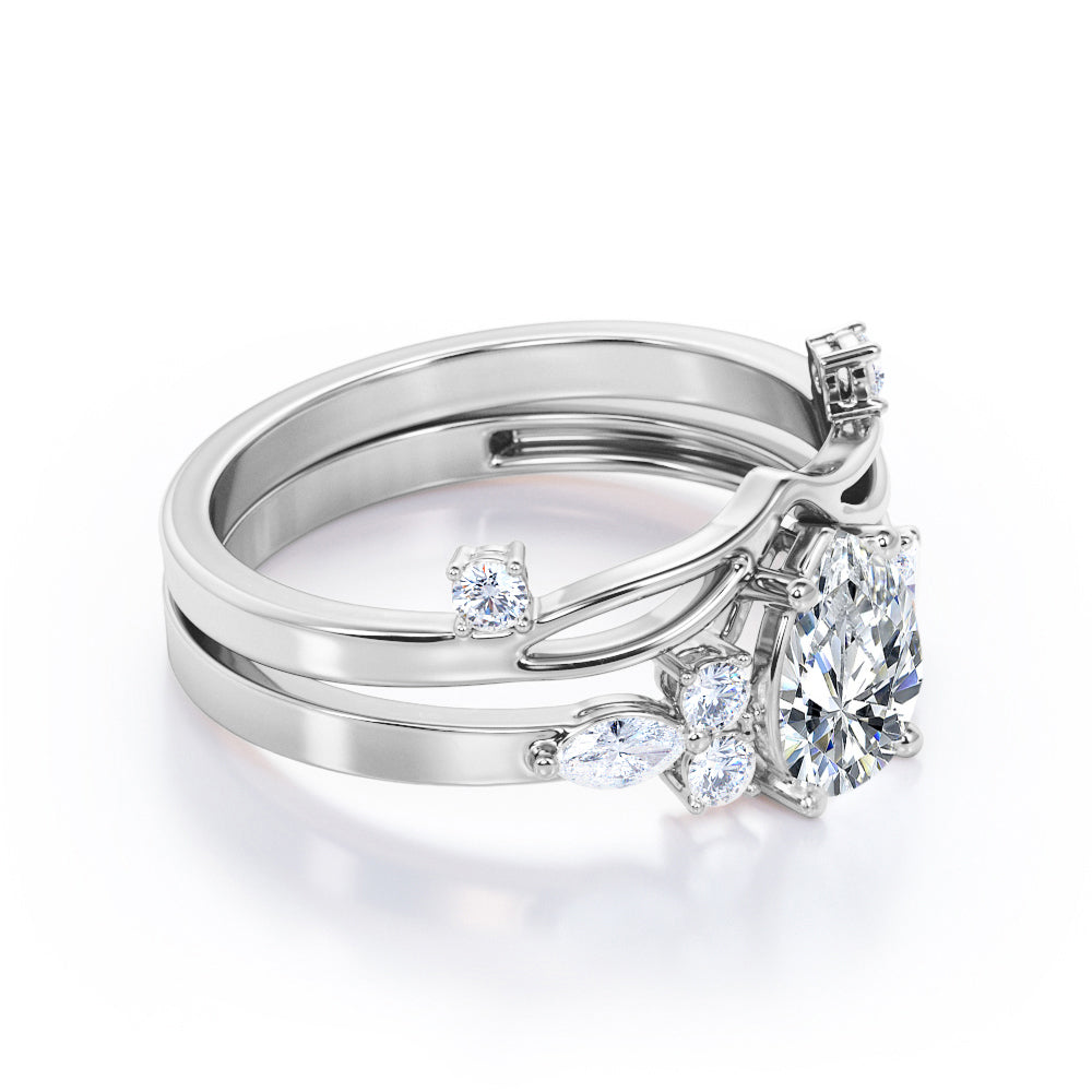 Split shank Chevron 1.2 carat tear drop shaped Moissanite and diamond art deco style engagement ring in Black gold