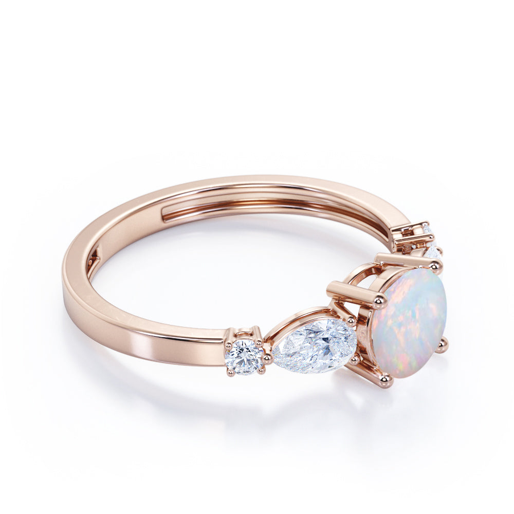 Eccentric 1.25 carat Round cut Ethiopian Opal and marquise and dot diamond engagement ring in Rose gold