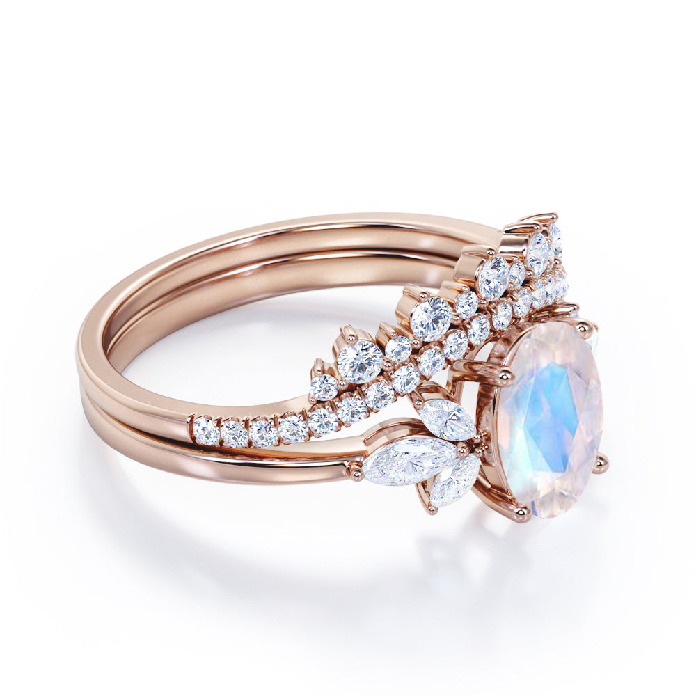 Garland Inspired 1.65 carat Oval shaped Blue Moonstone and diamond contoured seven stone Bridal set in Black gold