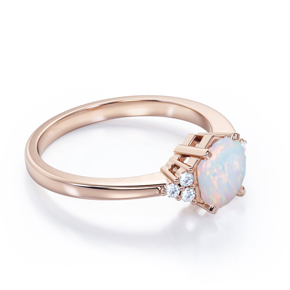Unique Tapered style 1 carat Round cut Opal and diamond 7 stone engagement ring in Yellow gold