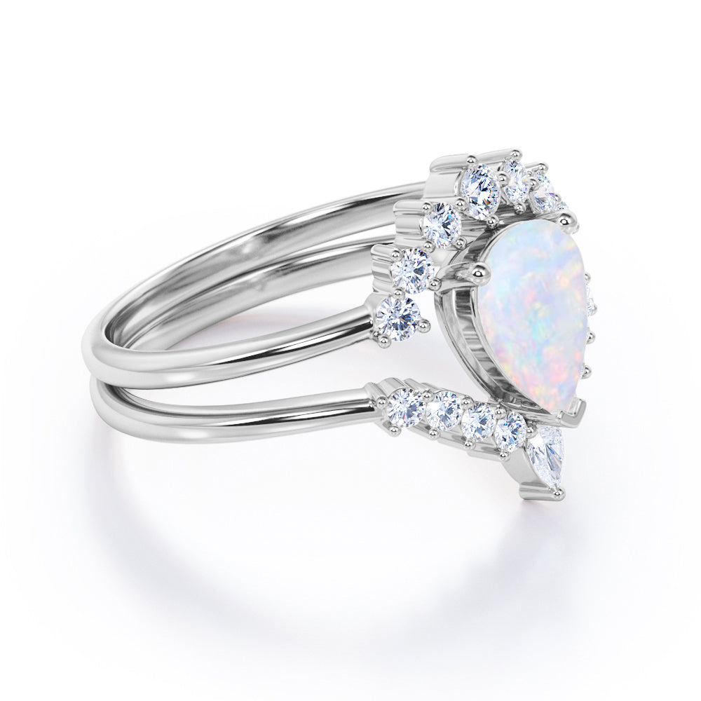 Royal Crown inspired 1.15 carat Pear cut Opal and diamond chevron wedding ring set for women in Rose gold