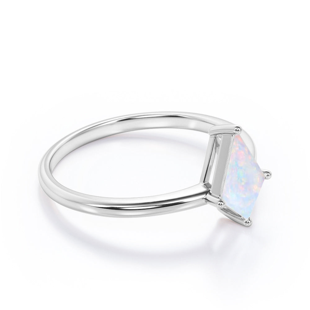 Classic 4 prong 1 carat Kite cut Ethiopian Opal solitaire engagement ring in Black gold