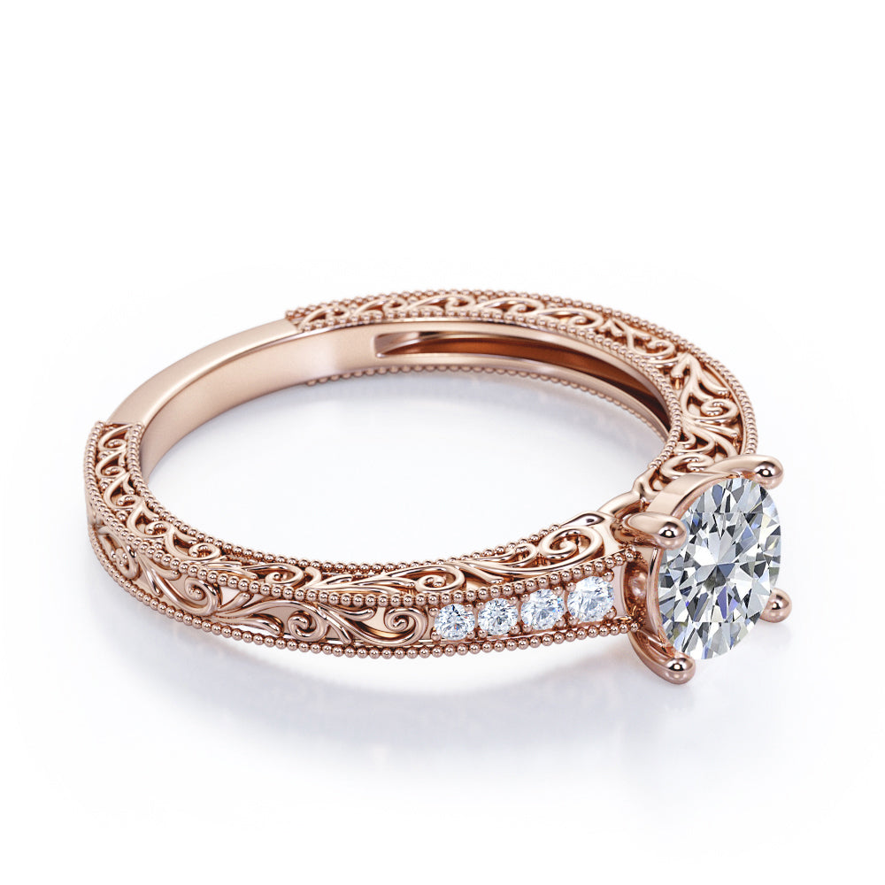 Artistic filigree 1.1 carat Moissanite and diamond low-basket setting engagement ring in White gold