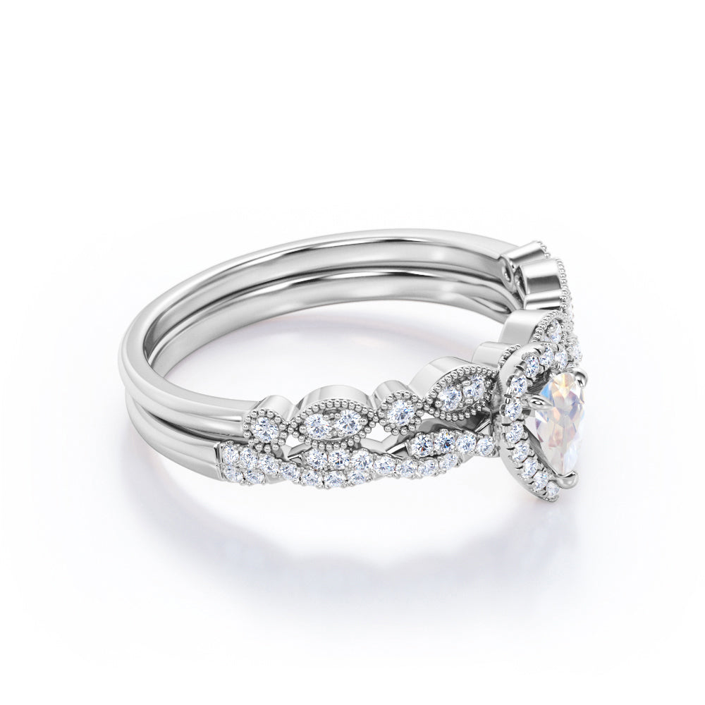 Art deco Milgrain 1.65 carat Pear cut Moonstone and diamond twisted pave engagement ring in yellow gold
