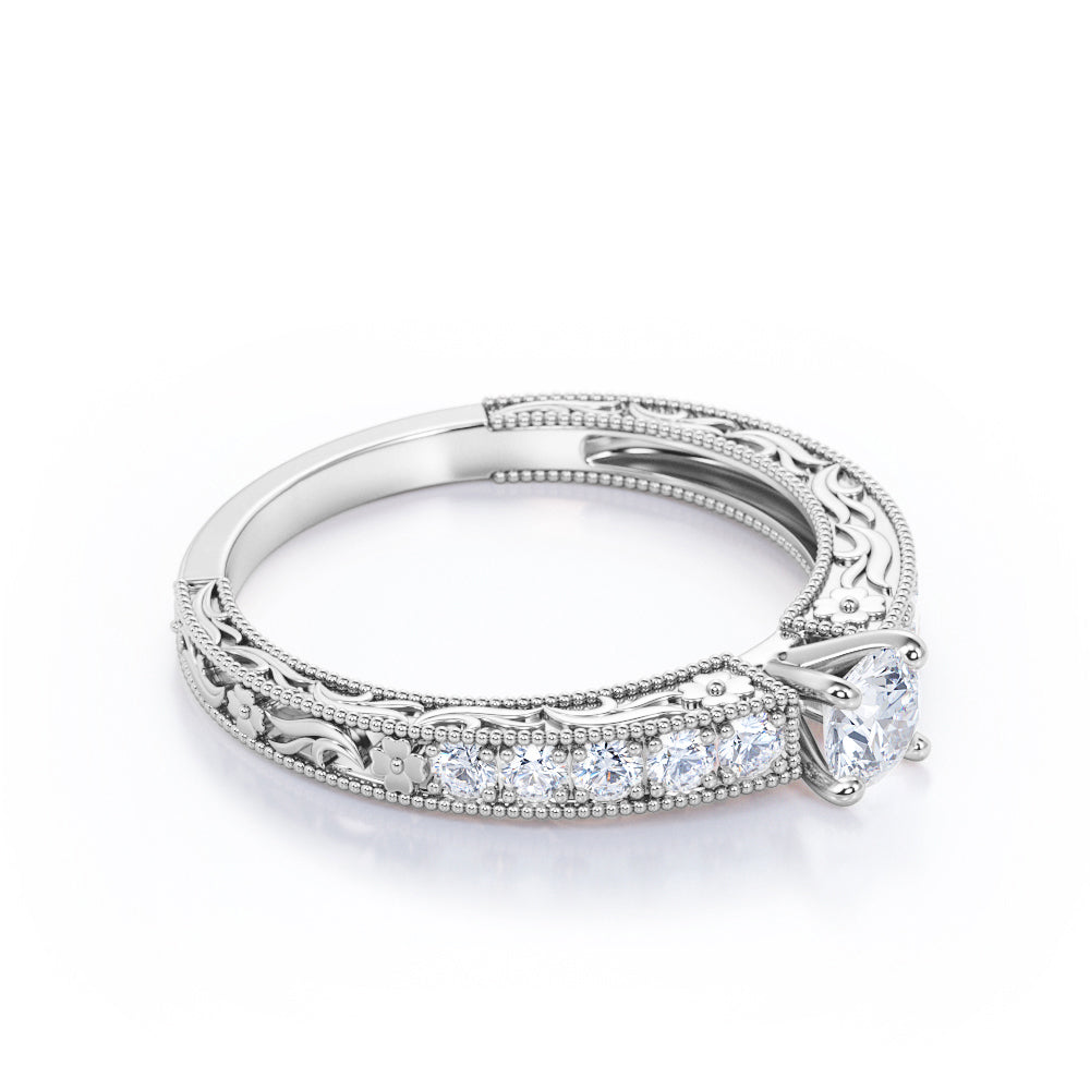 Victorian style 0.6 carat Round cut Moissanite and diamond Milgrain and filigree engagement ring in Rose gold