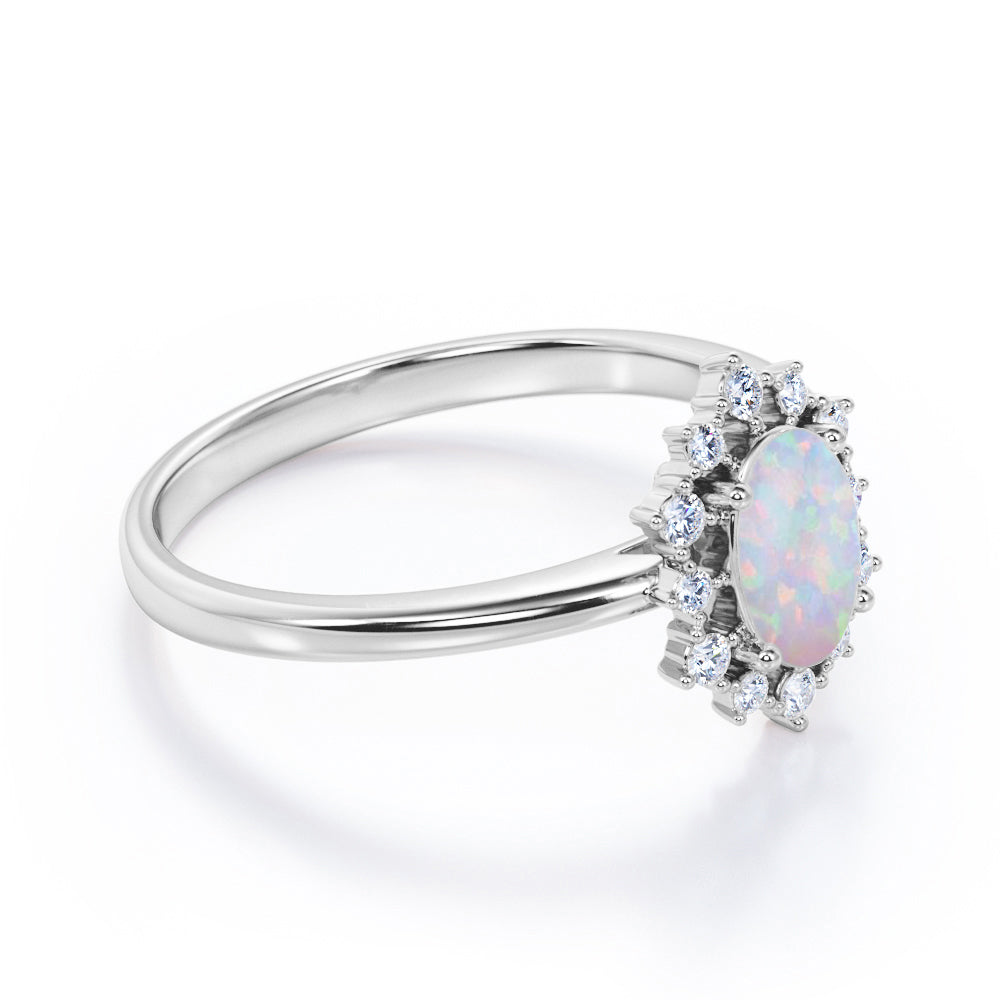 Intricate cluster 1.15 carat Oval cut Ethiopian Opal and diamond art deco engagement ring in Black gold