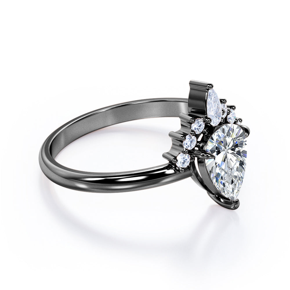 Chevron crown inspired 1.1 carat Pear shaped Moissanite and diamond engagement ring in Rose gold