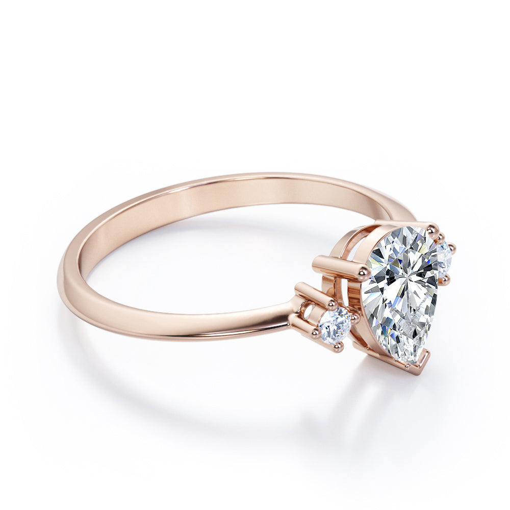 Classic Trinity 1 carat Pear shaped Moissanite and diamond-prong setting-pinched shank engagement ring in White gold