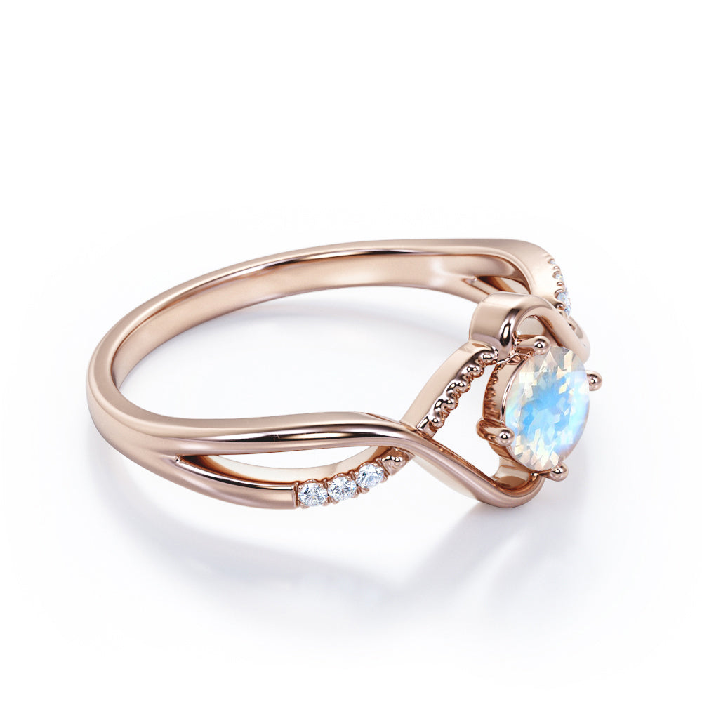 Trendy Twists 0.6 carat Round cut Rainbow Moonstone and diamond infinity pave engagement ring in White gold
