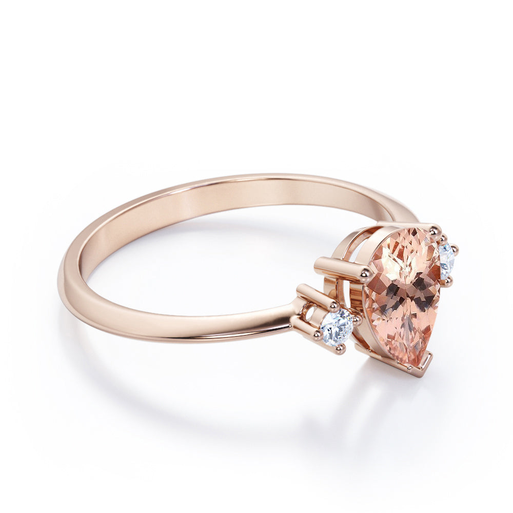 Three prong setting 1.1 carat Pear shaped Morganite and diamond trilogy anniversary ring for women in Black gold