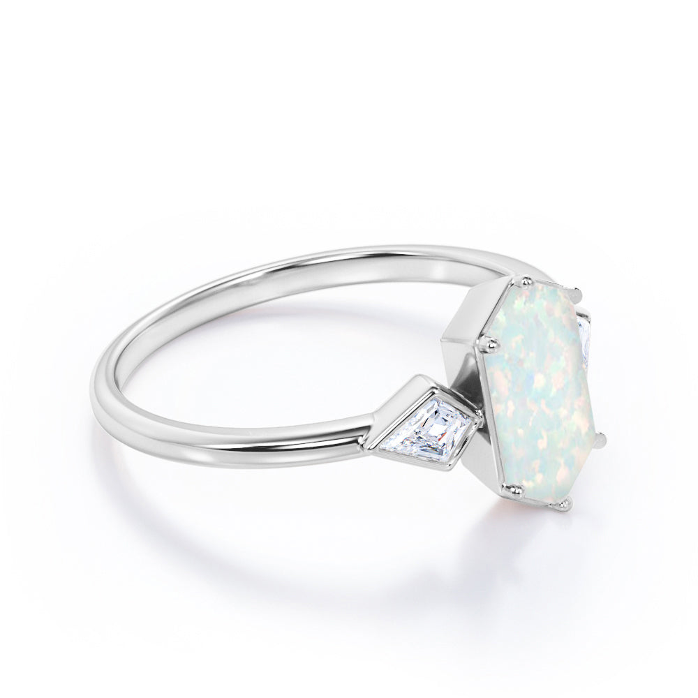 Elongated 1.10 carat Hexagonal Opal and marquise diamond bezel set engagement ring in Black gold