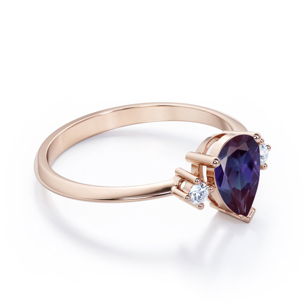 Classic three stone 1.1 carat Pear shaped Alexandrite and diamond pinched shank engagement ring for women in Black gold